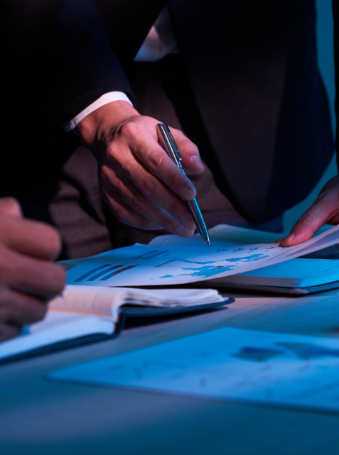 Close-up image of business partners working with financial documents